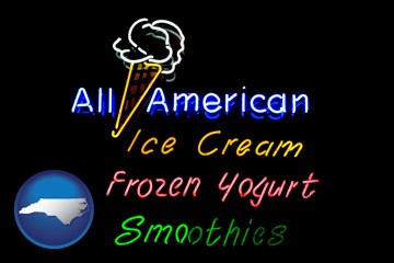 a neon sign, advertising ice cream, frozen yogurt, and smoothies - with North Carolina icon